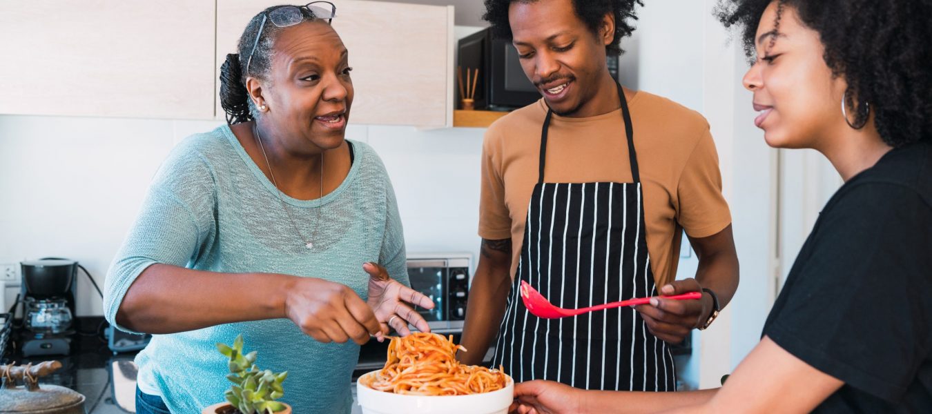 Portrait of family cook together at home.